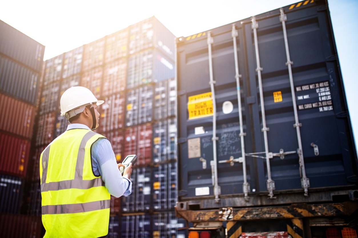 Foreman control loading Containers box from Cargo freight ship for import export, foreman control Industrial Container Cargo freight ship