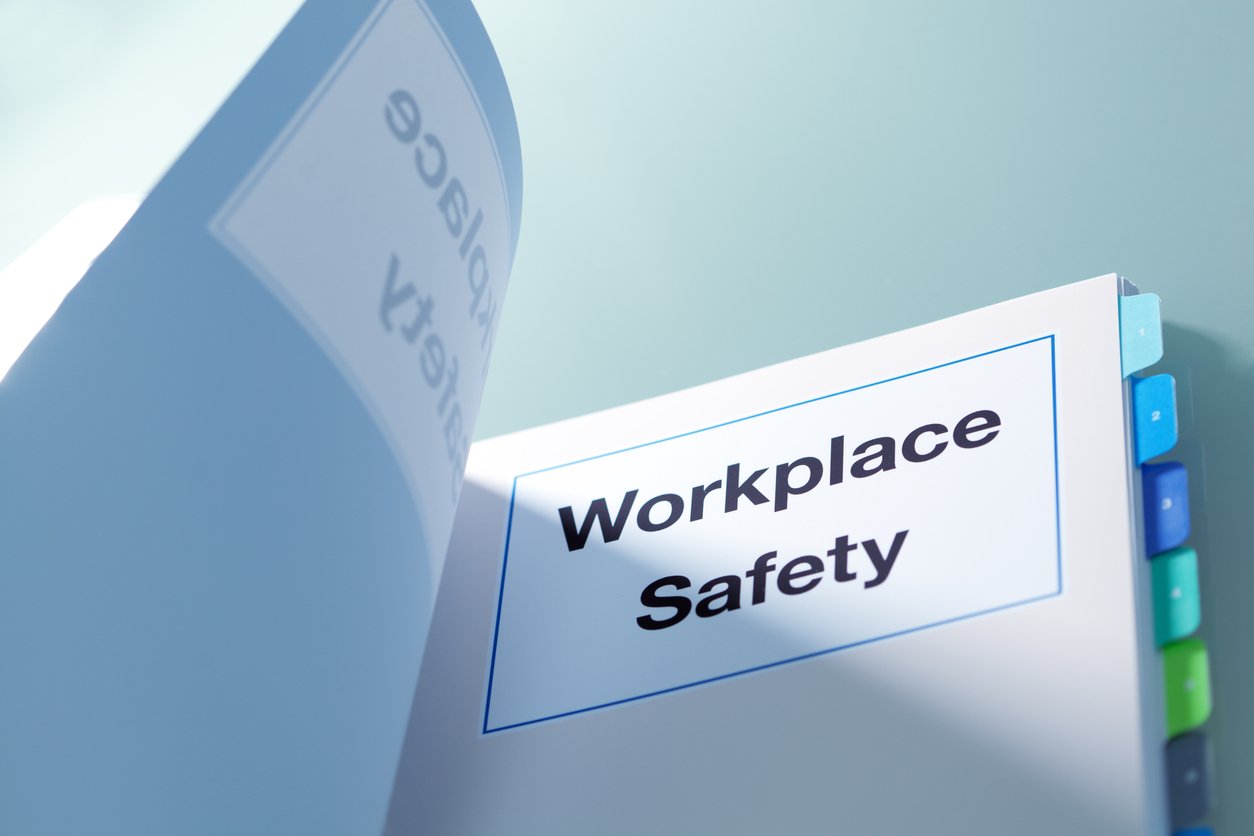 Tabbed manual titled "Workplace Safety"