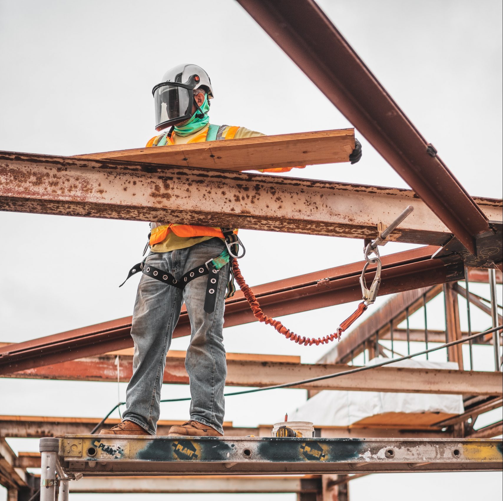 workmen on site with scaffolding